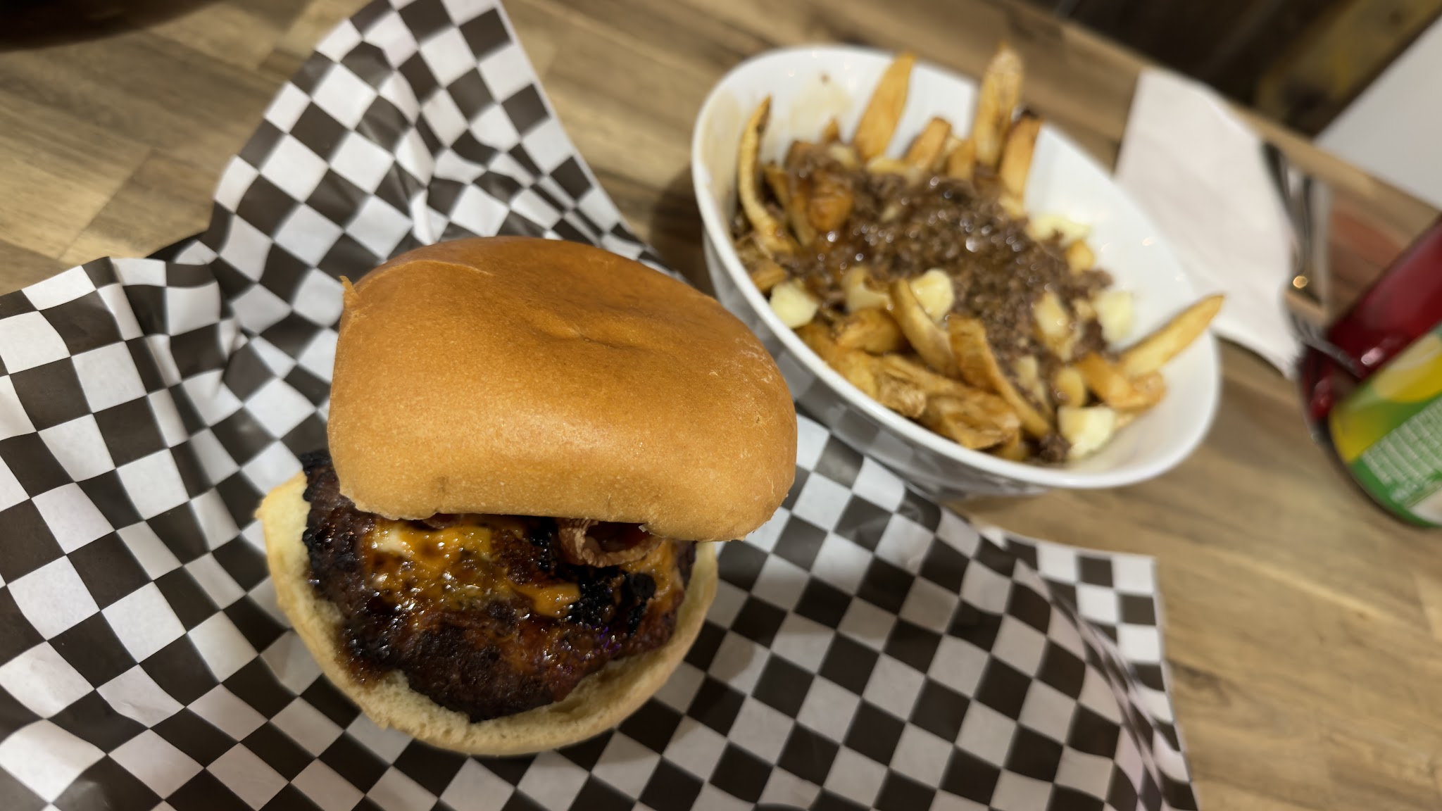 Smash burger with cheese and poutine on the side